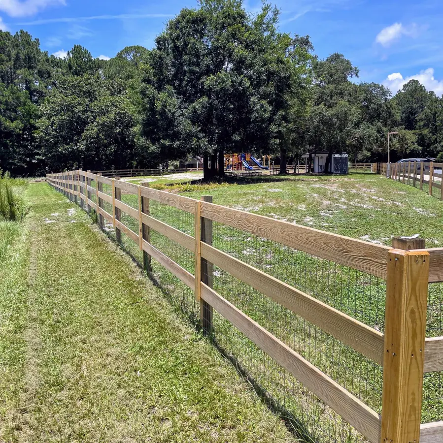 Lawn along a wooden rail fence